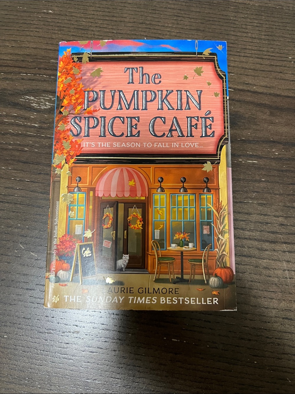 The Pumpkin Spice Café by - Orange Cover